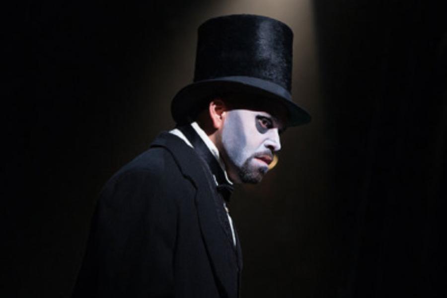 Justin Lee Miller as the auctioneer in The Phantom of the Opera on Broadway 2014